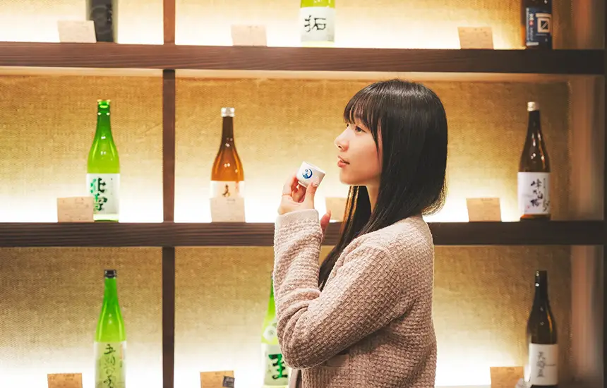 The Exterior or Interior of a Beautiful Japanese Sake Brewery with Sake Bottles
on Display