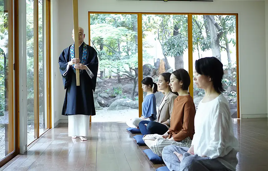 A person enjoying a quiet moment in a traditional Japanese room.