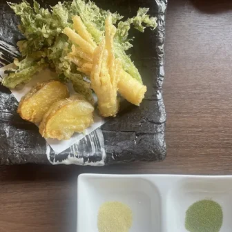 Seasonal Japanese spring vegetable tempura with two kinds of flavored salt