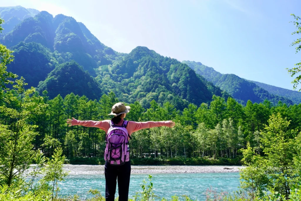 A person enjoying trekking with essential gear 
